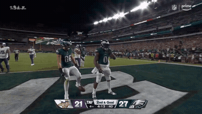Two Football Players Celebrate 2Nd And Goal GIF