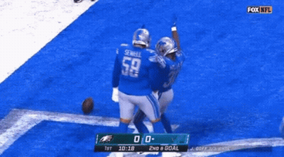 Two Football Players Celebrating Goal GIF