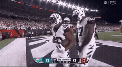 Two Football Players Celebrating Touchdown Bengals Vs Dolphins GIF