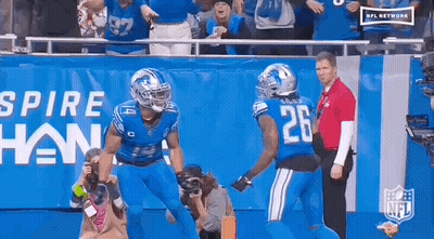 Two Football Players Celebrating Touchdown GIF