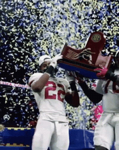 Two Football Players Holding Trophy Jersey 22 GIF