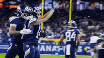 Two Football Players Hugging Number 84 GIF