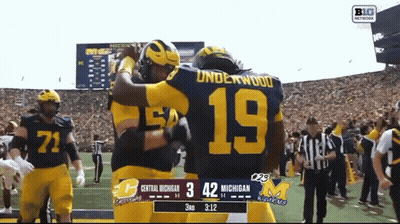 Two Football Players Hugging With Number 19 GIF