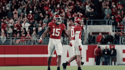 Two Football Players In Red Uniforms Number 15 GIF