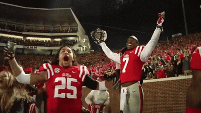 Two Football Players In Red Uniforms Number 25 GIF