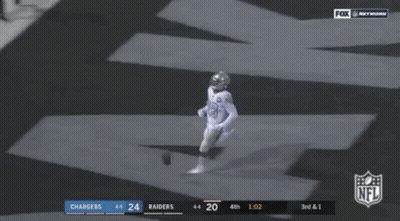 Two Football Players Laying On Ground NFL Touchdown GIF