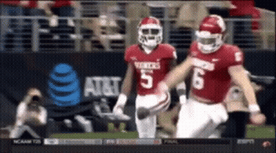 Two Football Players Number 5 And 6 Running GIF