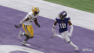 Two Football Players On A Field With Netflix Written On The Bottom GIF