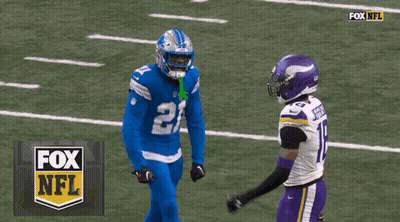 Two Football Players On A Field With The Fox Nfl Logo In The Background GIF