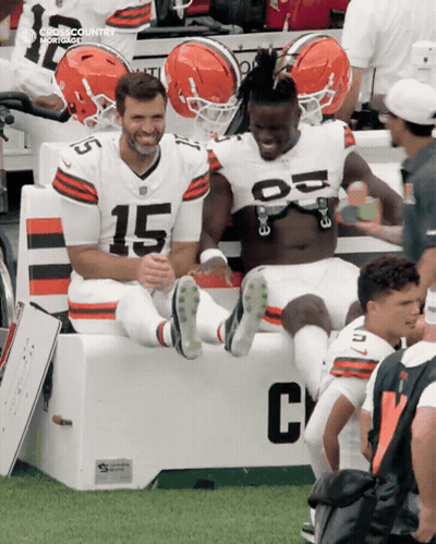 Two Football Players On Bench Number 15 GIF