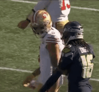 Two Football Players On Field During Game GIF