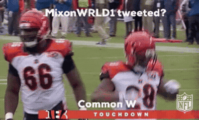 Two Football Players On Field Mixon Wrld Tweeted GIF