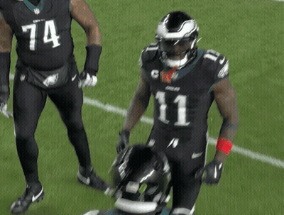 Two Football Players One Wearing Number 1 GIF
