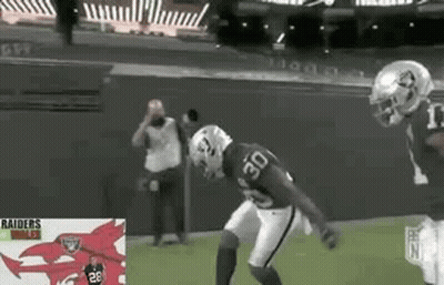 Two Football Players Playing Game One Wearing Number 30 Jersey GIF
