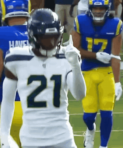 Two Football Players Standing On Field GIF