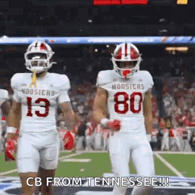 Two Football Players Walking On Field Number 80 Jersey GIF
