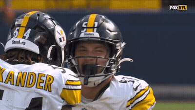 Two Football Players With Kander Jersey GIF