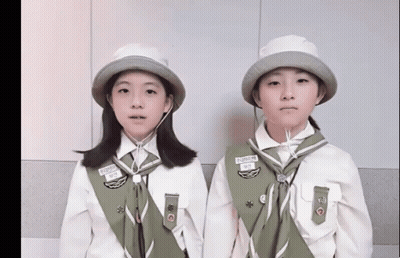 Two Girl Scouts One With Supreme Name Tag GIF