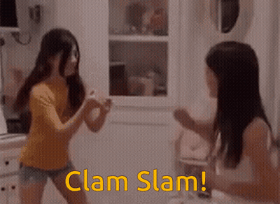 Two Girls Are Fighting In A Kitchen And The Words Clam Slam Are Visible GIF