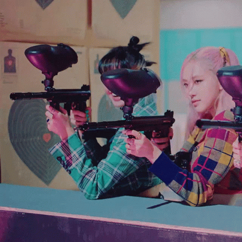 Two Girls Holding Paintball Guns GIF