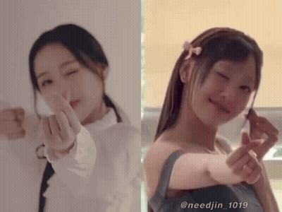 Two Girls Are Making A Heart Shape With Their Hands GIF