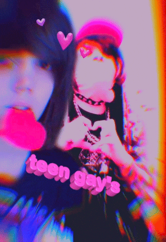 Two Girls Are Making A Heart Shape With Their Hands And The Words Teen Gay 'S On The Bottom GIF