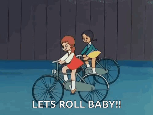 Two Girls Are Riding Bicycles In A Cartoon With The Words `` Let 'S Roll Baby ! '' GIF