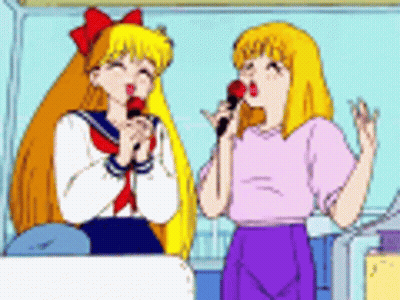 Two Girls Are Singing Into Microphones In A Cartoon GIF