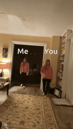 Two Girls Are Standing In A Living Room With The Words Me And You Written Above Them GIF