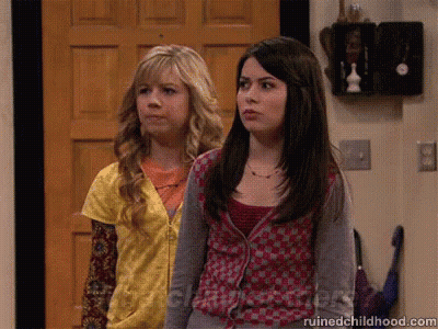 Two Girls Are Standing In Front Of A Door And The Website Ruinedchildhood.com Is Visible GIF