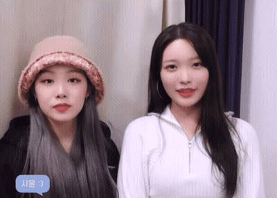 Two Girls Are Standing Next To Each Other With A Speech Bubble That Says ' Ae ' GIF