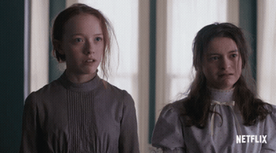 Two Girls Are Standing Next To Each Other With Netflix Written On The Bottom GIF