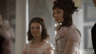 Two Girls Are Standing Next To Each Other With Netflix Written On The Bottom Right GIF