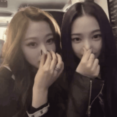 Two Girls Covering Faces With Hands One With Ring GIF