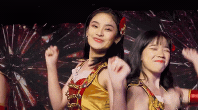Two Girls Dancing On Stage, One In Gold GIF