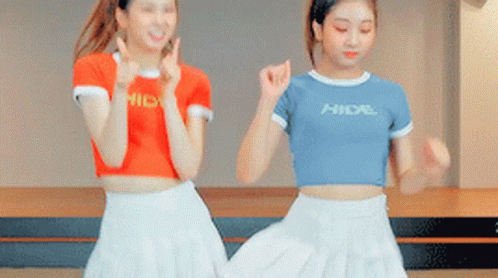 Two Girls Dancing One Wearing Hidal Shirt GIF