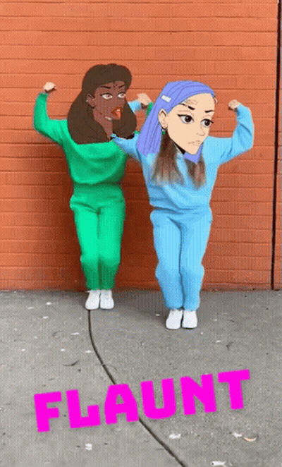 Two Girls Flexing Muscles With Pink Flaunt On Brick Wall GIF