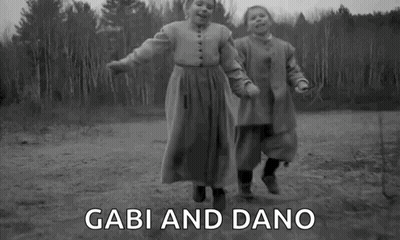 Two Girls Holding Hands Jumping GIF
