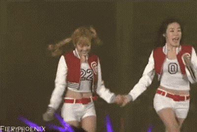 Two Girls Holding Hands On Stage With Fieryphoenix GIF