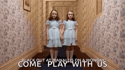 Two Girls In Blue Dresses In Hallway GIF