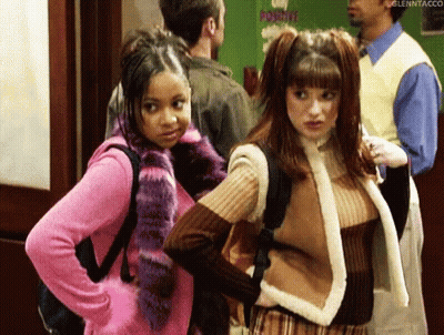 Two Girls In Hallway With Man Behind GIF
