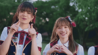 Two Girls In School Uniforms Making Heart Shape GIF