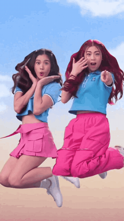 Two Girls Jumping One Pointing GIF