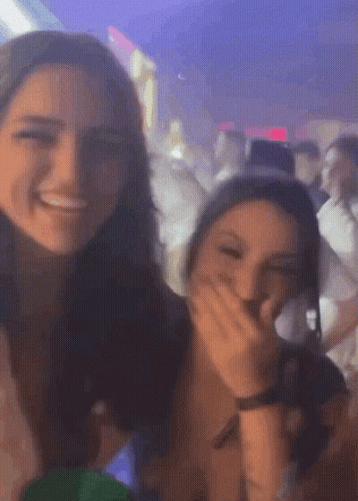 Two Girls Laughing Covering Mouths GIF