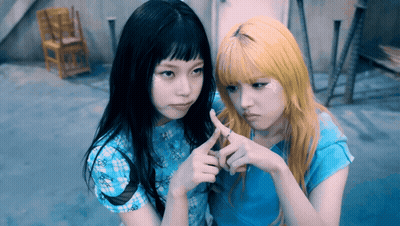 Two Girls Making Heart Shape, One Ring GIF