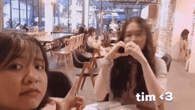 Two Girls Making Heart Shape With Hands Tim GIF