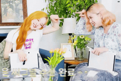 Two Girls On Couch With Mighty Shirt GIF