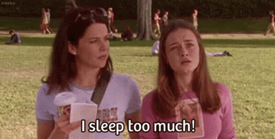 Two Girls One With Coffee One With Book GIF