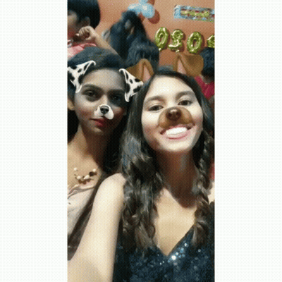 Two Girls Posing One With Dog Face Mask GIF