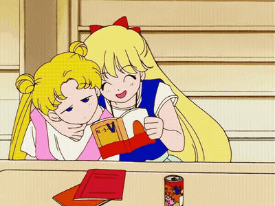 Two Girls Reading Book With Letter V GIF